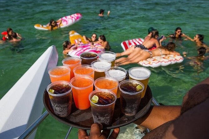 Bavaro Punta Cana EN boat party with drinks and transportation - Thirty minutes of snorkeling and a slide at Bavaro Beach