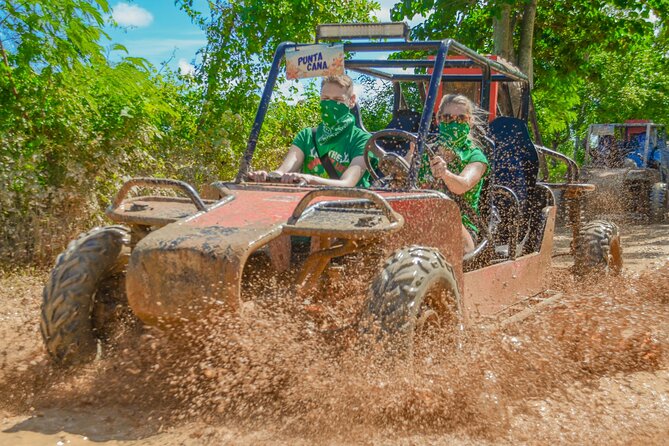 Buggy Tour in Punta Cana with Stops at the Beach and a Cave - Taking the wheel on muddy Dominican trails