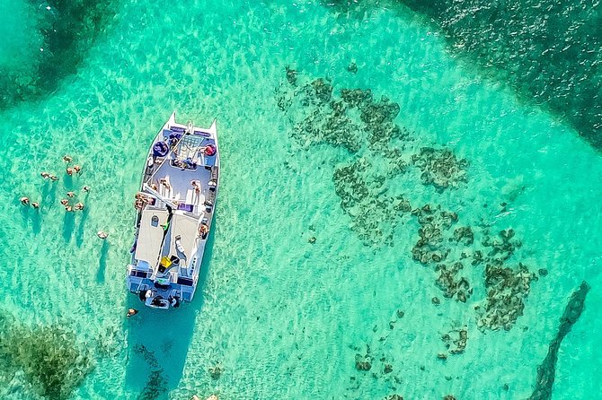 Catamaran Cruise with Snorkeling & Parasailing - Parasailing above the Dominican coast