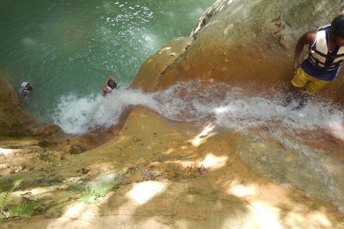 Hiking the 27 Waterfalls of Damajagua Tour from Santo Domingo - Jumping and sliding down the falls