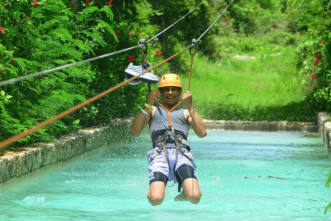 Jet Ski Punta Cana Water Park with Zipline & Inflatable Course - Tackling the giant inflatable obstacle course