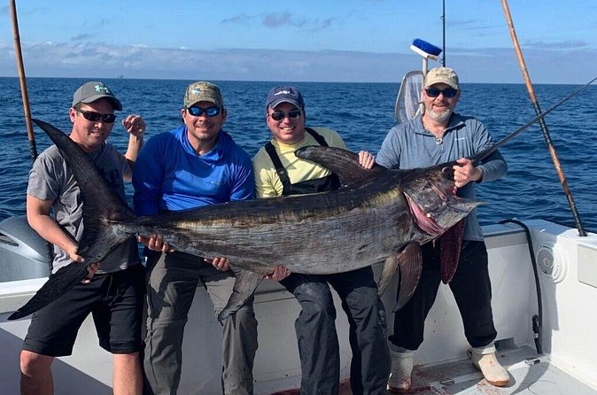Private Fishing Charter in Punta Cana (Emmanuel) - Drinks, sandwiches, and tropical fruit at sea