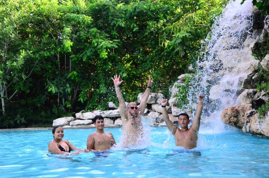 Punta Cana: Bávaro Adventure Park Horse Riding & Waterfalls - Cooling off at the Waterfall Pool
