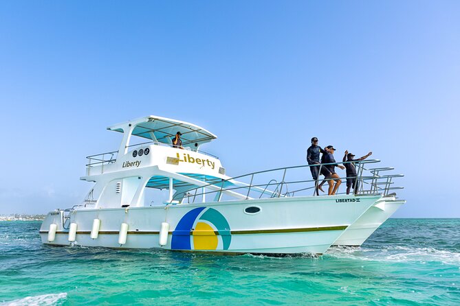 Punta Cana Boat Cruise and Snorkeling with Open Bar - A note about dolphins, sharks, and changing stops