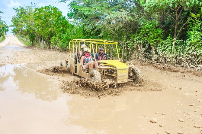 Punta Cana Buggy with Cave Dip, Mamajuana Tasting & Macao Beach - Getting muddy on the buggy route